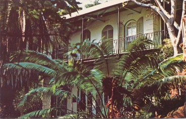 Featured is a postcard image of the Key West home of one of America's favorite and most celebrated writers of Fiction ... Ernest Hemingway.  The original unused card from the 1960s is for sale in The unltd.com Store.